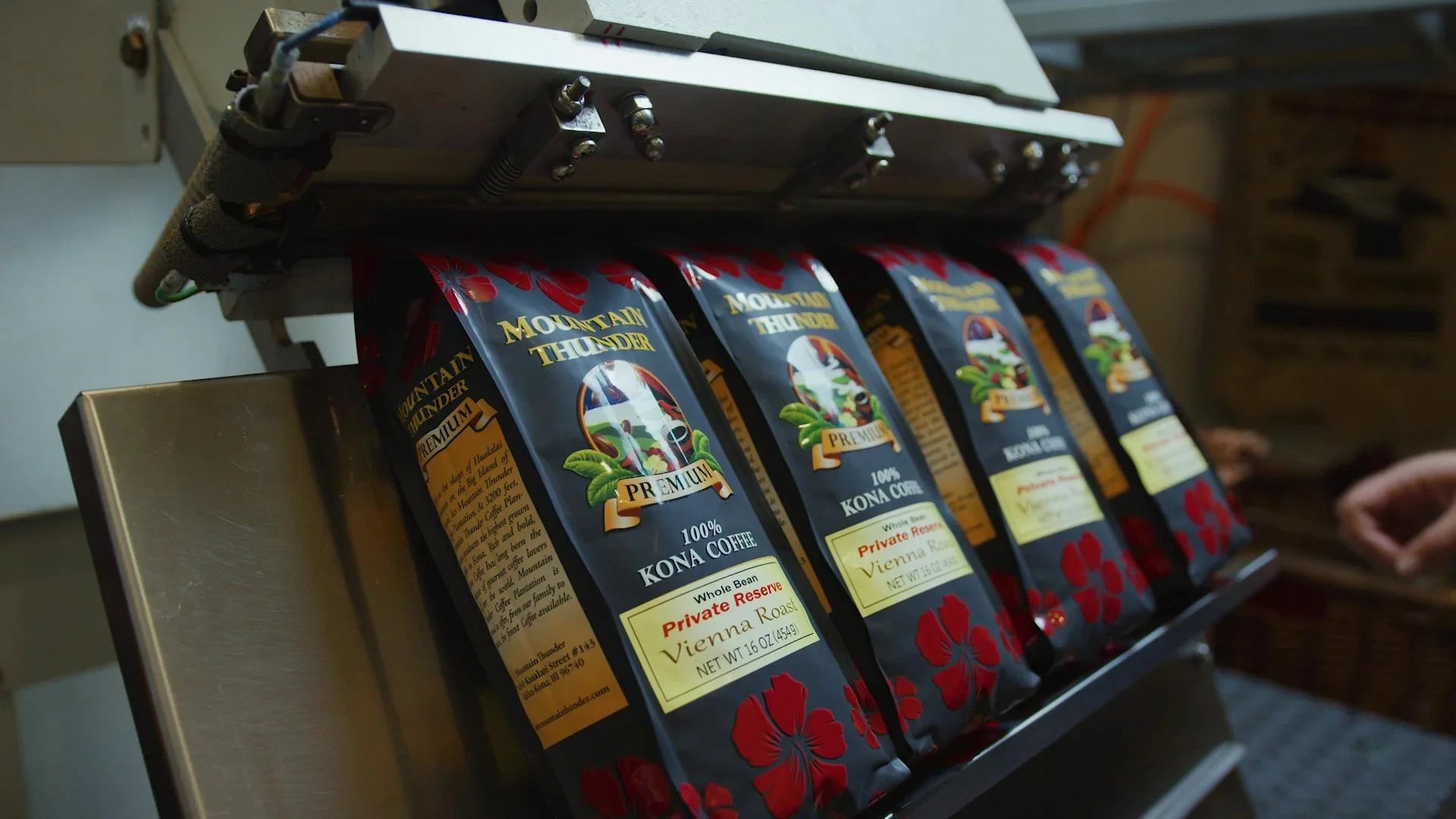 The packaging process is happening in a production line