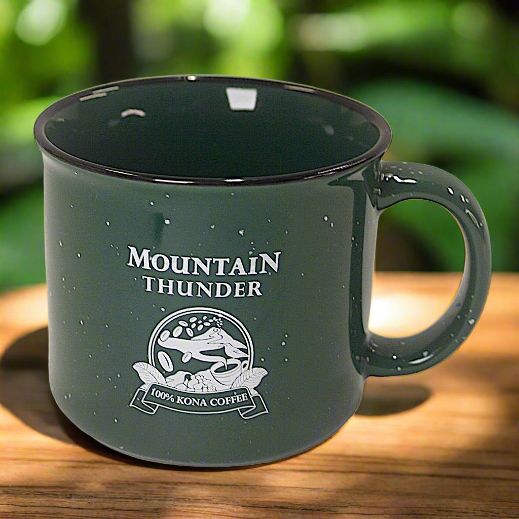 dark green ceramic campfire style mug with white speckles, black rim and white mountain thunder logo