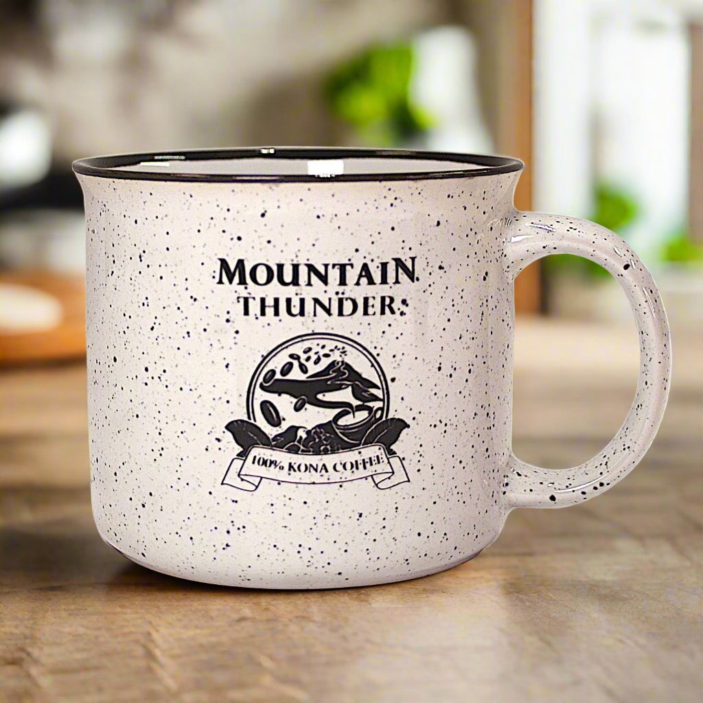 ceramic white campfire mug with black speckles and mountain thunder logo