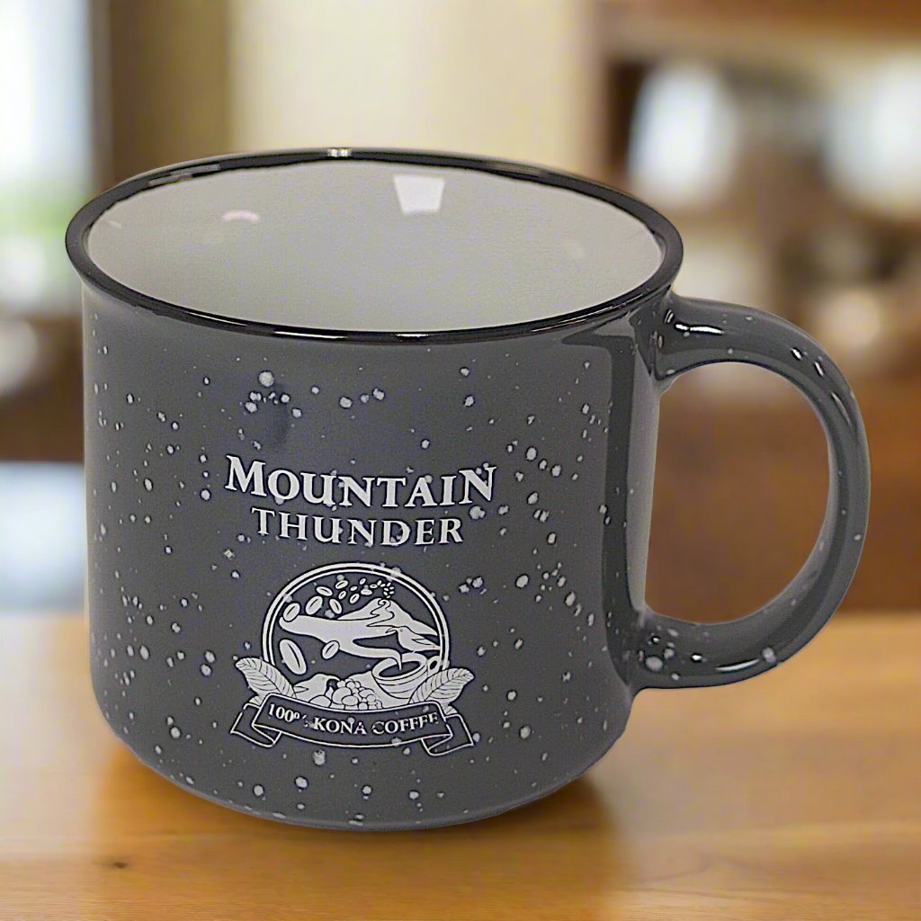 dark grey ceramic mug with light grey speckles, white interior, black lip, and mountain thunder logo