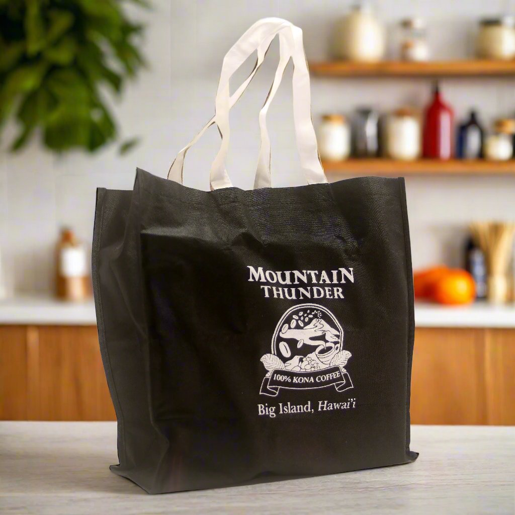 large black reusable tote bag with white handles and white mountain thunder logo