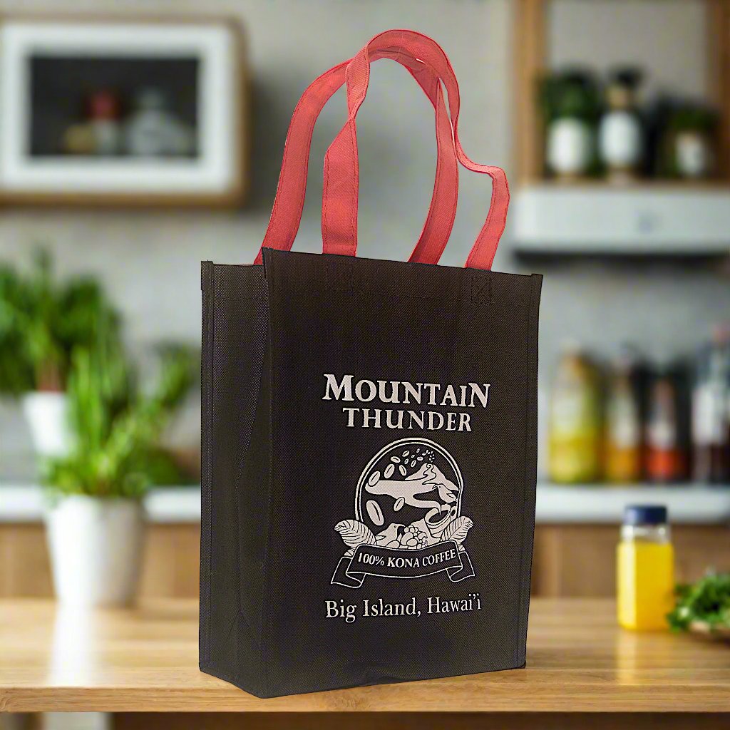 small black reusable tote bag with red handles and white mountain thunder logo