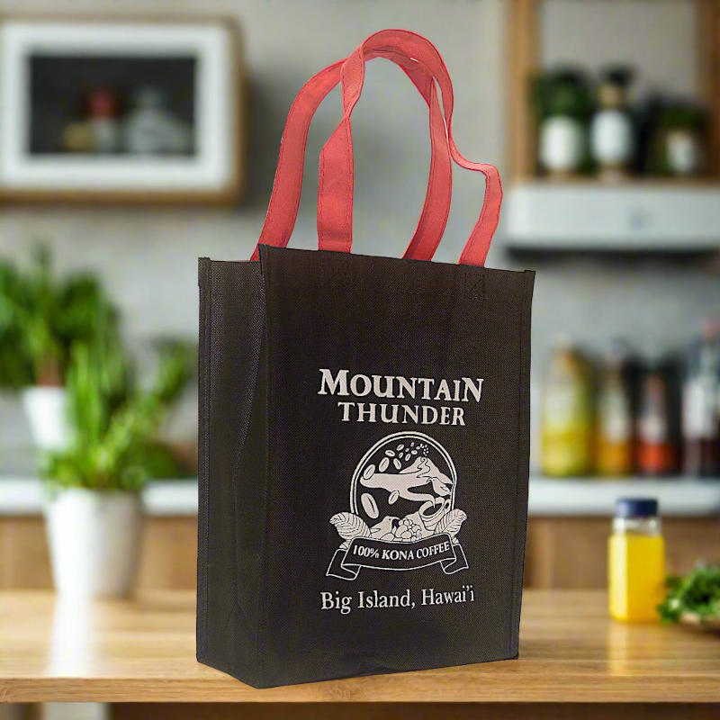 small black reusable tote bag with red handles and white mountain thunder logo