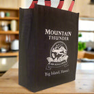 reusable tote bag with red handles and white mountain thunder logo